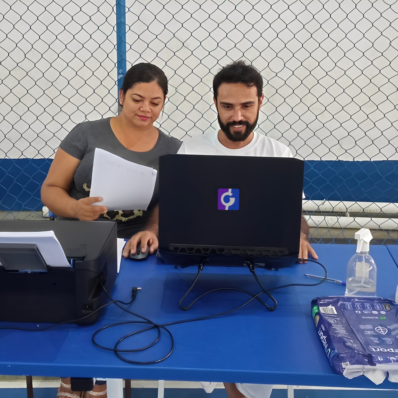 Membros fundadores do GingArena, capoeiristas, trabalhando no sistema de gestão de eventos